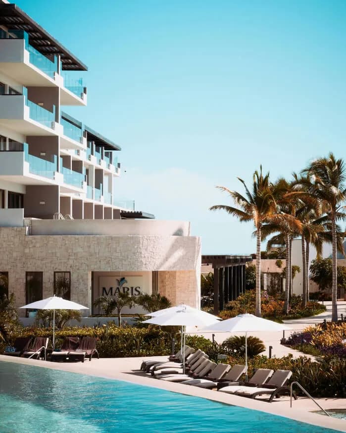 exterior view of beach resort condo with pool